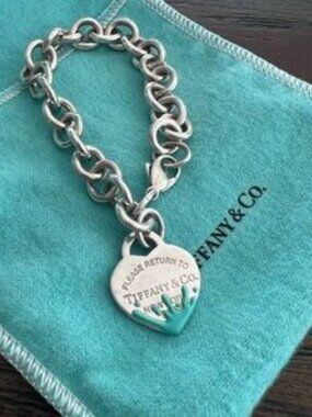 Tiffany and Co bracelet with blue splash charm